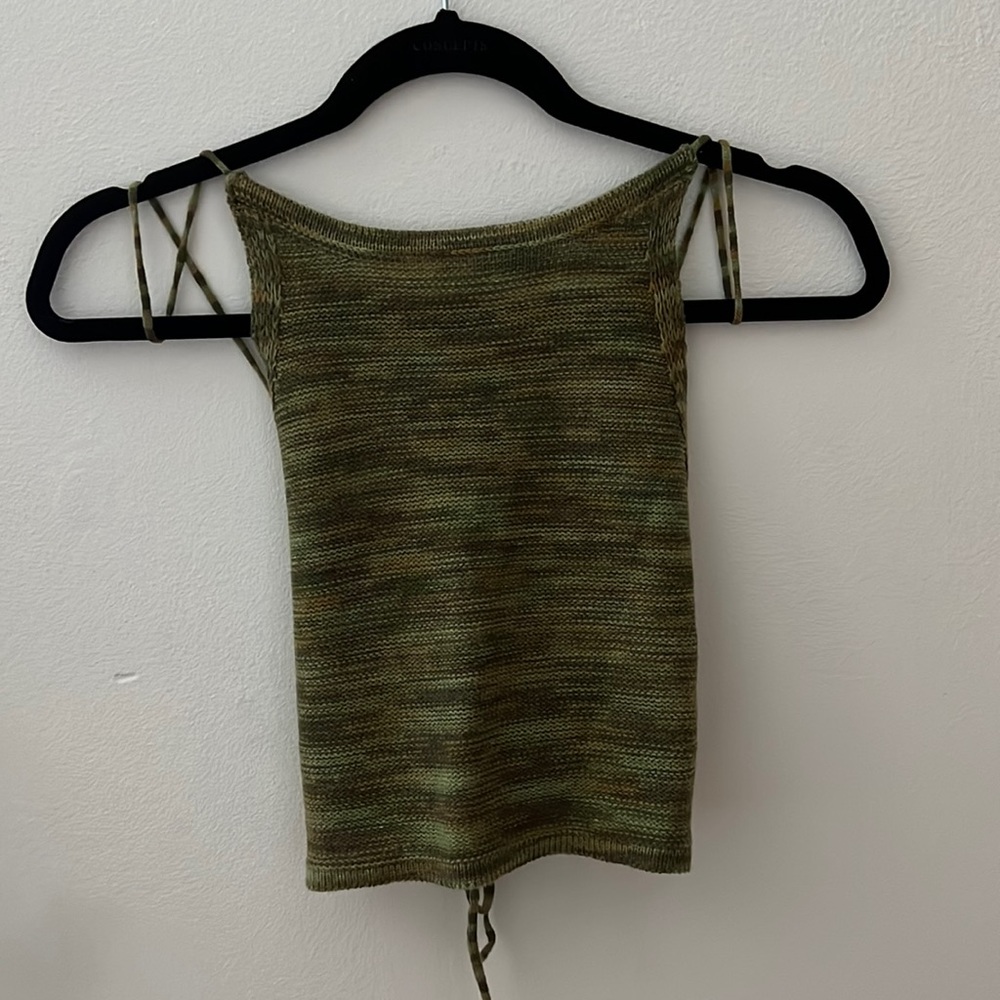 A cute knit tank with a low back that ties. Super cute and never worn!